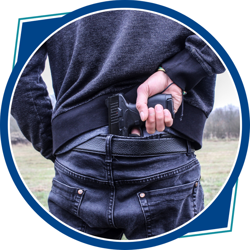 pulling handgun out of belt behind back